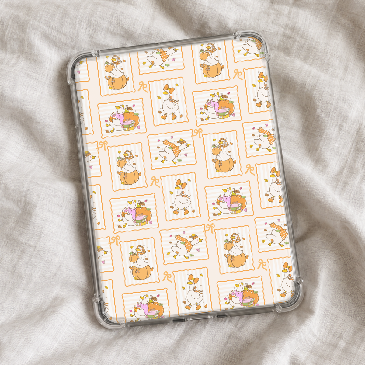 Cute autumn Kindle insert featuring whimsical geese with pumpkins, cozy sweaters, fall leaves, books, and seasonal accessories arranged in orange scalloped frames with dainty bow details.