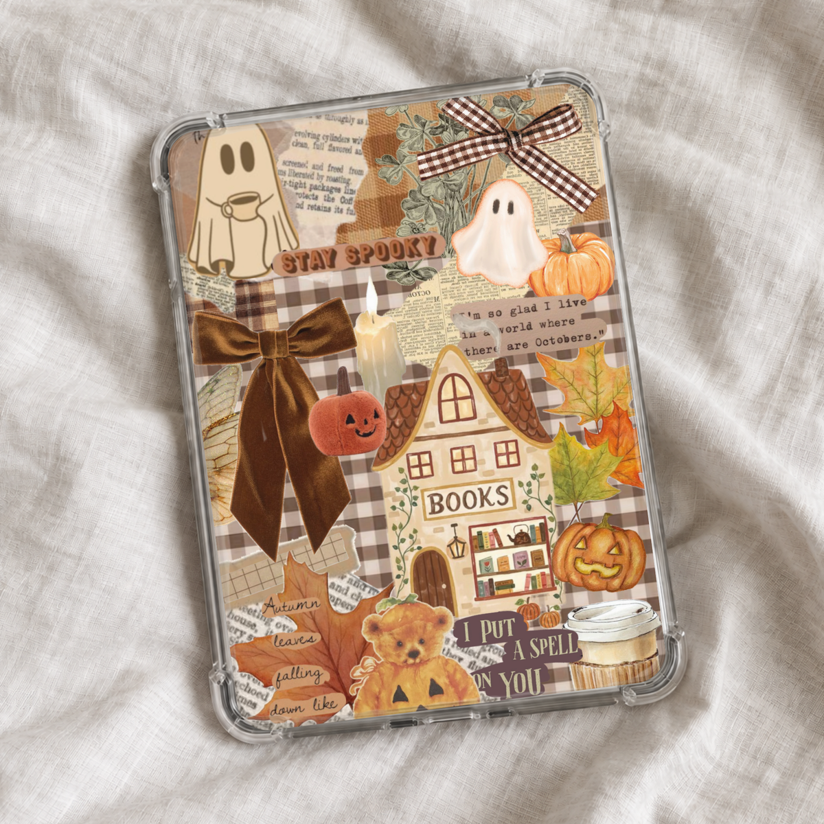 Cozy spooky autumn Kindle insert featuring a vintage collage of ghosts, pumpkins, fall leaves, gingham bows, candles, coffee, and a whimsical bookshop in warm brown and orange tones.