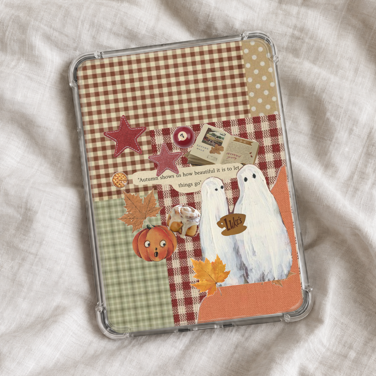Cozy autumn Kindle insert featuring a vintage collage of plaid patterns, fall leaves, pumpkins, cinnamon rolls, books, stars, and two cute ghosts with warm orange, red, green, and cream tones.